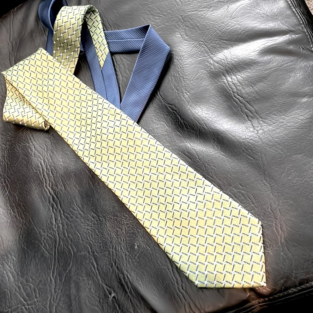 100% silk necktie, Tommy Hilfiger. Good condition. See photo of minor flaw.